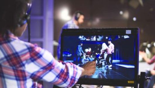 Event Professional working on video production for live event