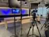 Business leaders participate in live event broadcast from office